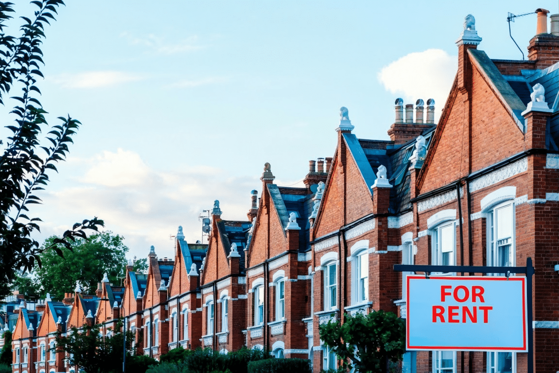 For Rent sign outside a row of houses
